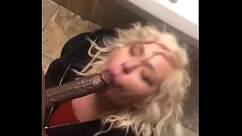 Thick white girl sucking black dick in restroom