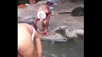 black women bathing by the river