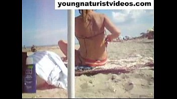 nude girl dressing on beach