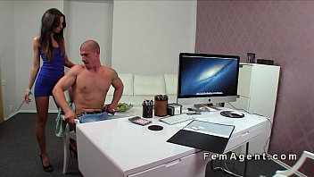 Muscled guy licks female agent on a desk