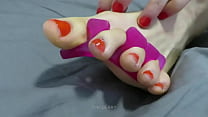 Red toe nail polish application