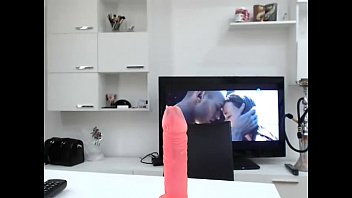 Busty 18 year old sucking a long dildo on Live69Girls.Com